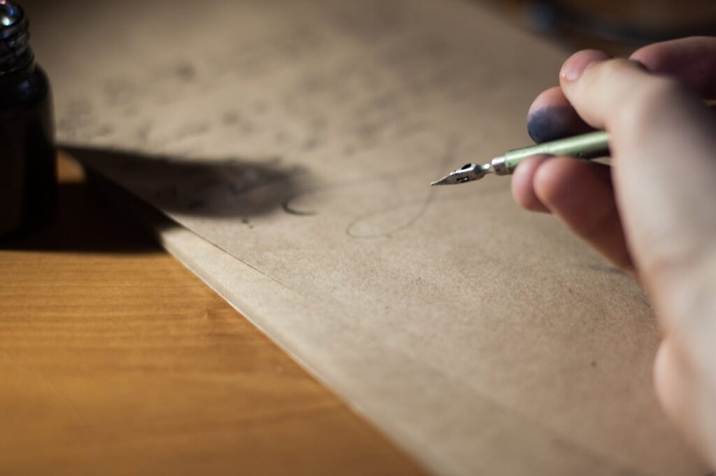 A person writing a healing letter to their younger self as an act of reparenting.